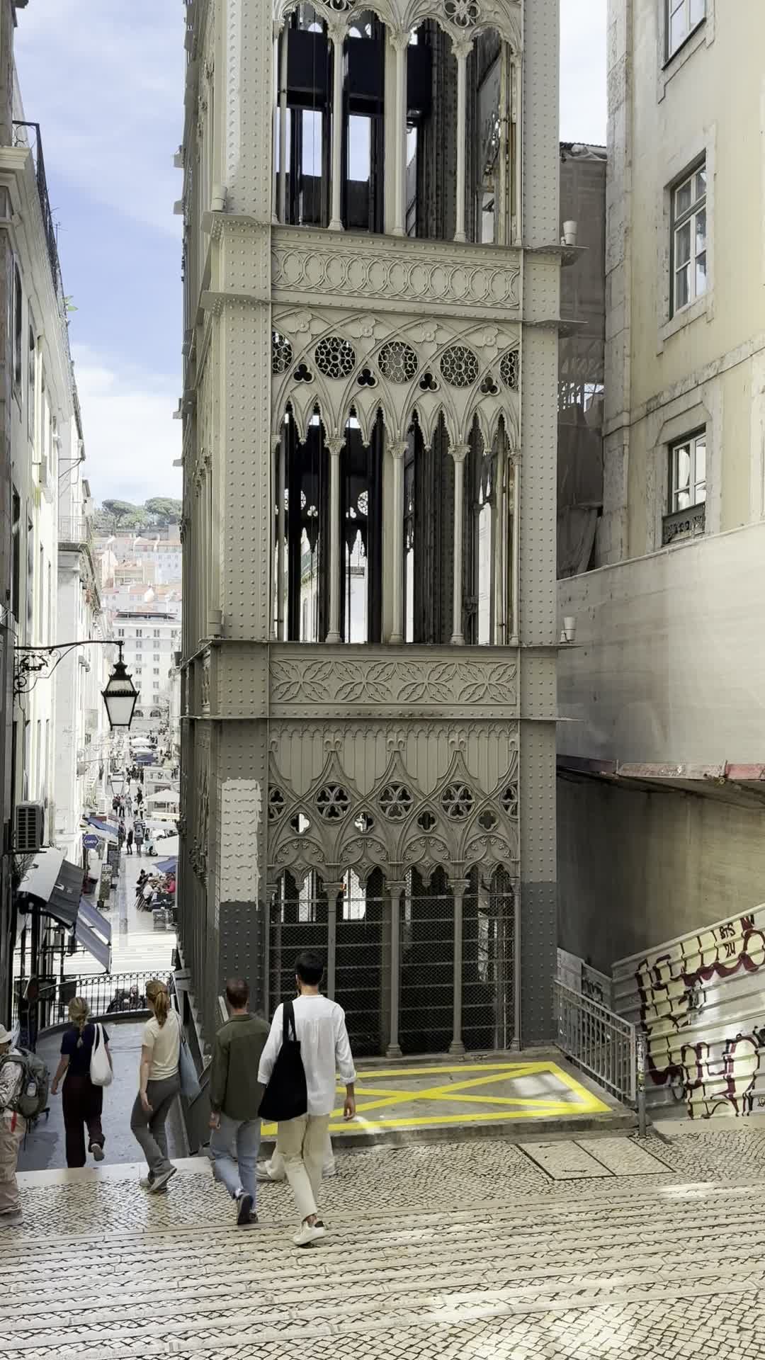 The iron Santa Justa Lift rising between narrow Lisbon streets.