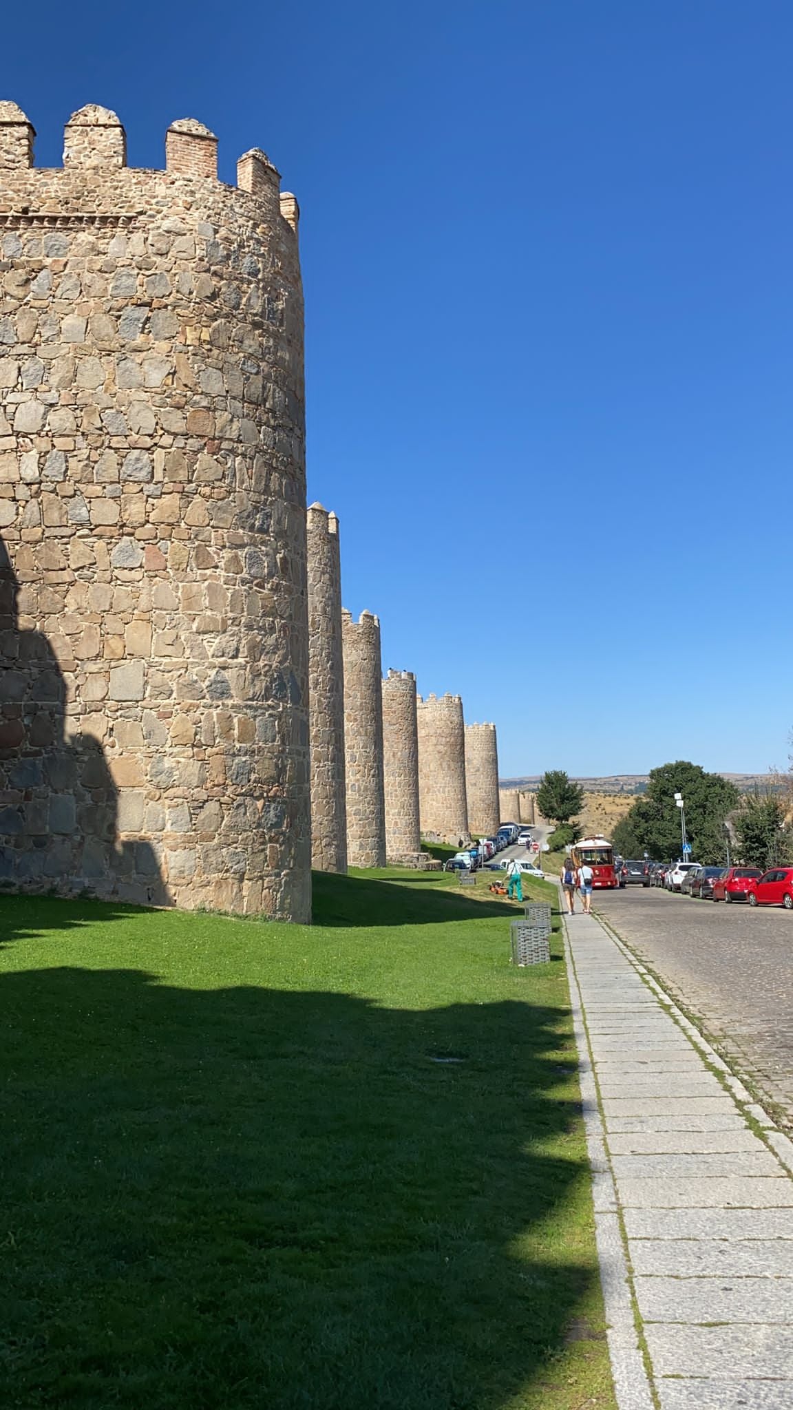 A line of stone towers along the medieval walls of Ávila