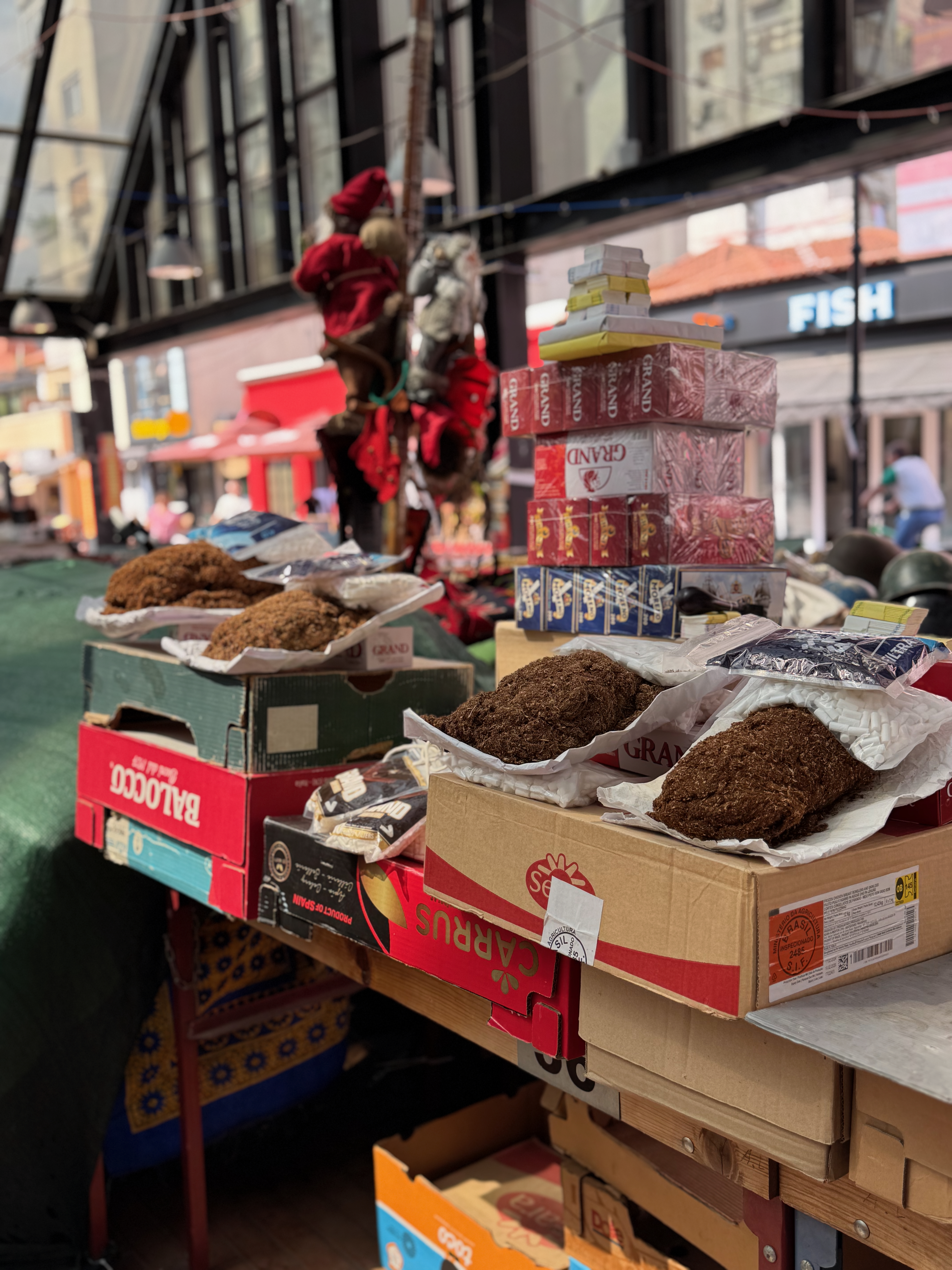 Loose tobacco and small goods for sale at Tirana's Old Bazaar