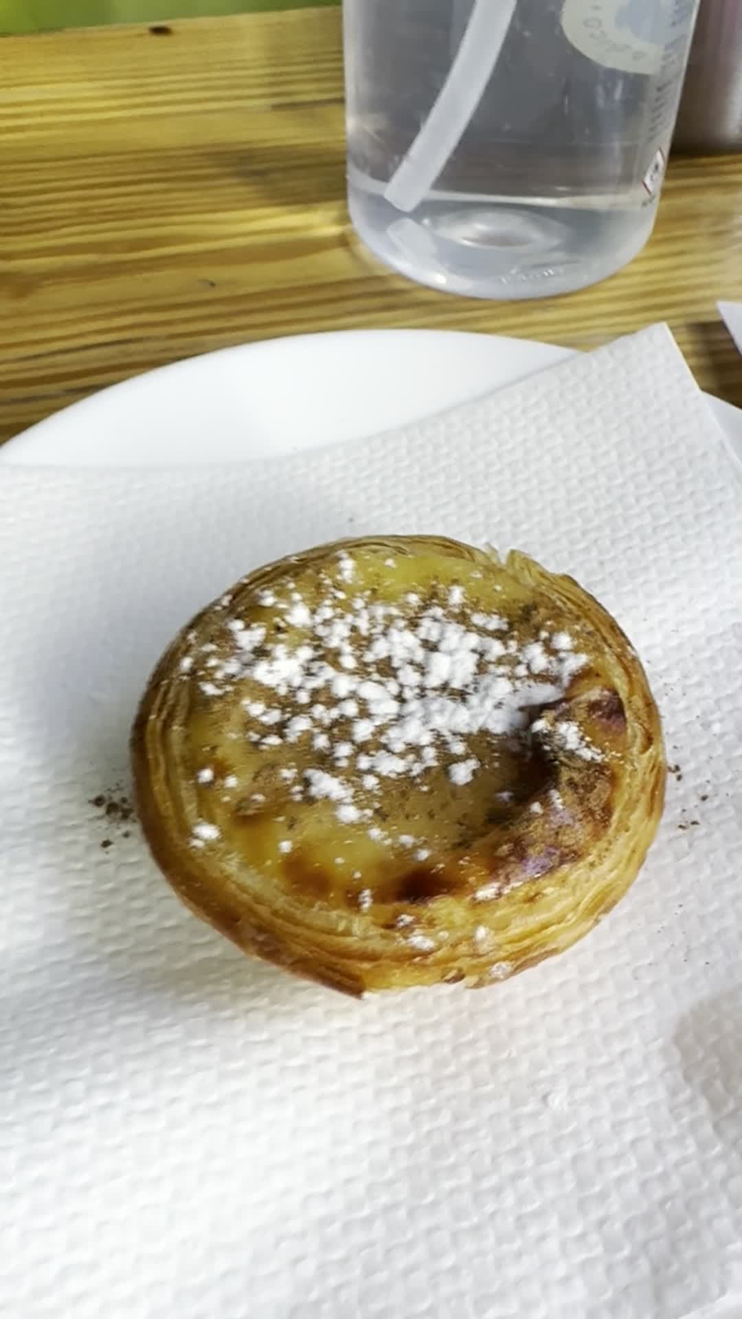 A pastel de nata on a white napkin in Lisbon.