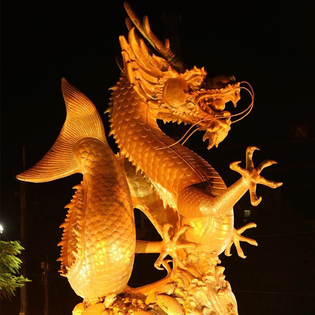Illuminated dragon sculpture in Phuket Old Town at night