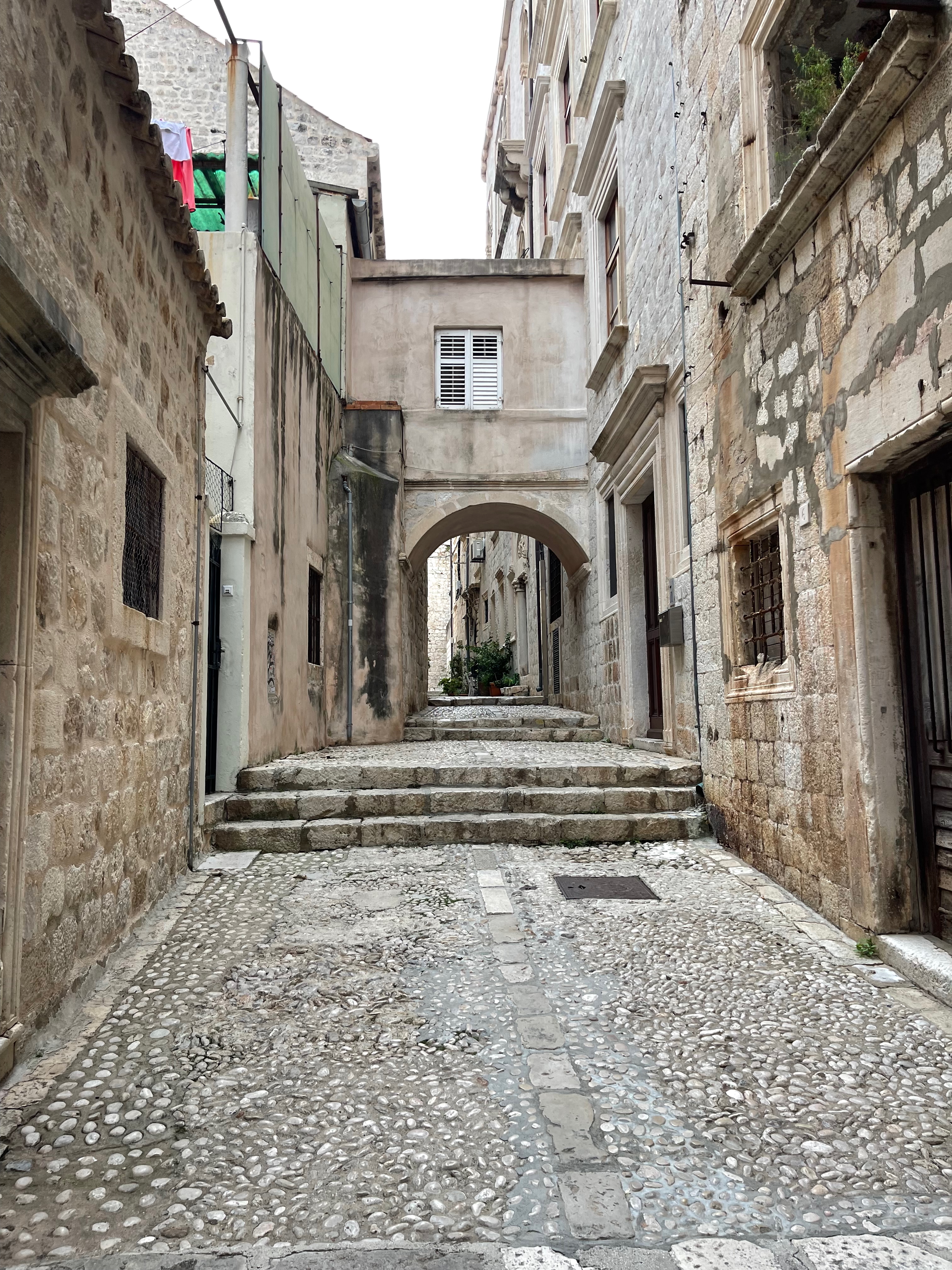 Quiet limestone lane and steps inside Dubrovnik Old Town