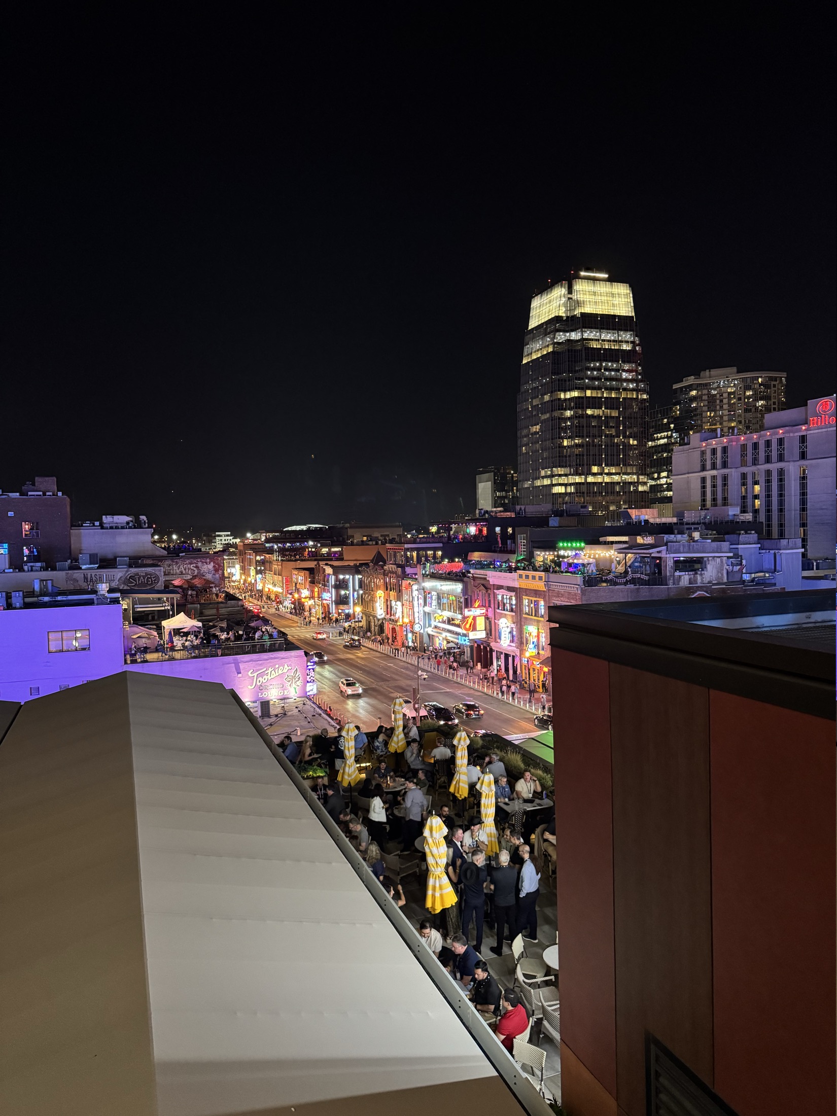 Broadway in downtown Nashville lit up at night from above