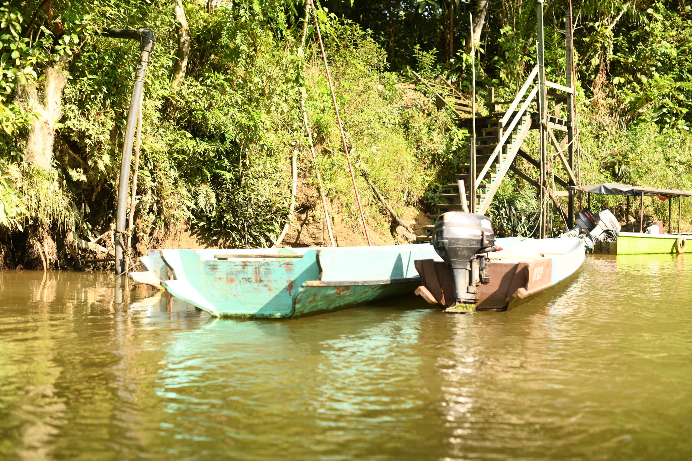 Longboat along the river near Clearwater Cave
