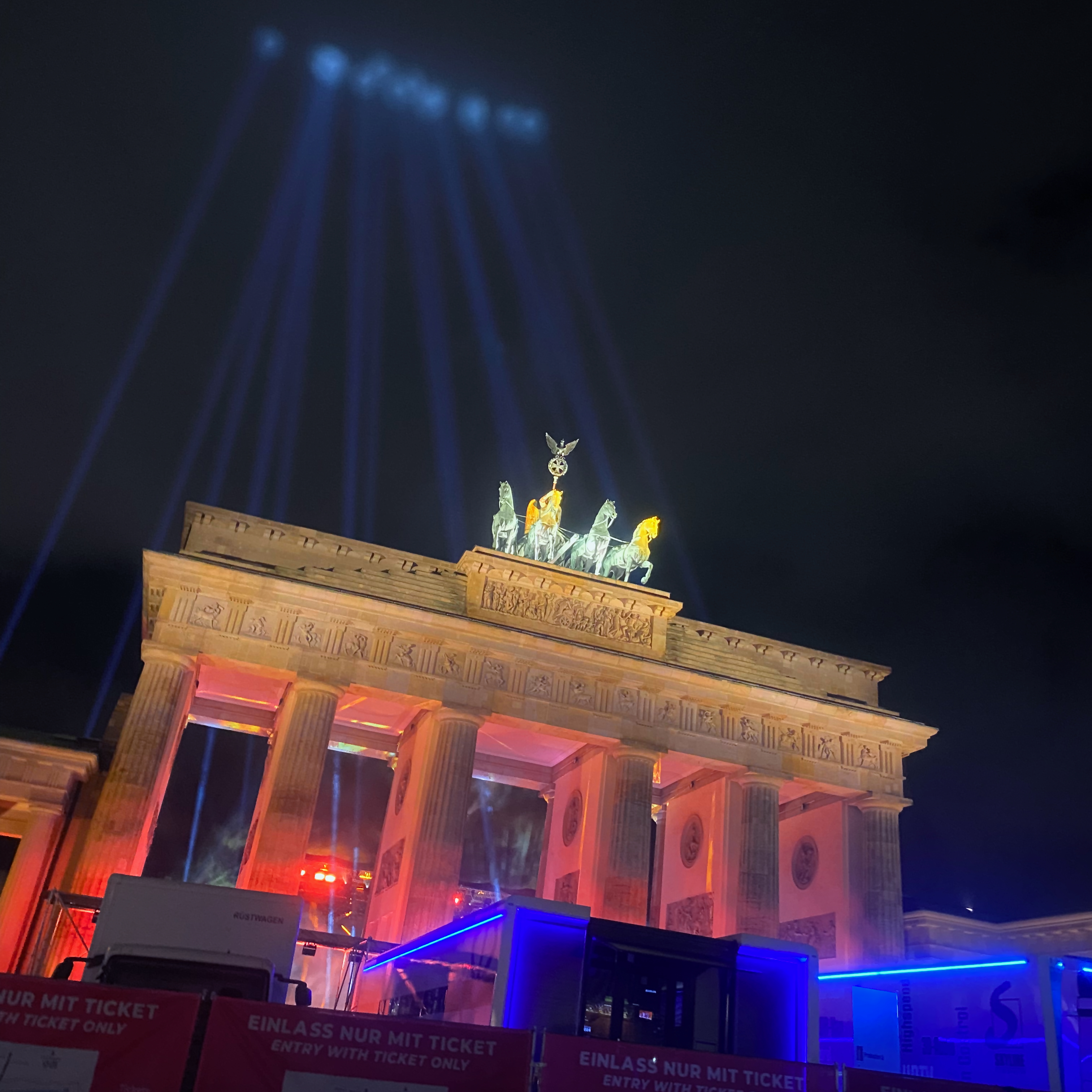 The Brandenburg Gate lit at night during a light installation