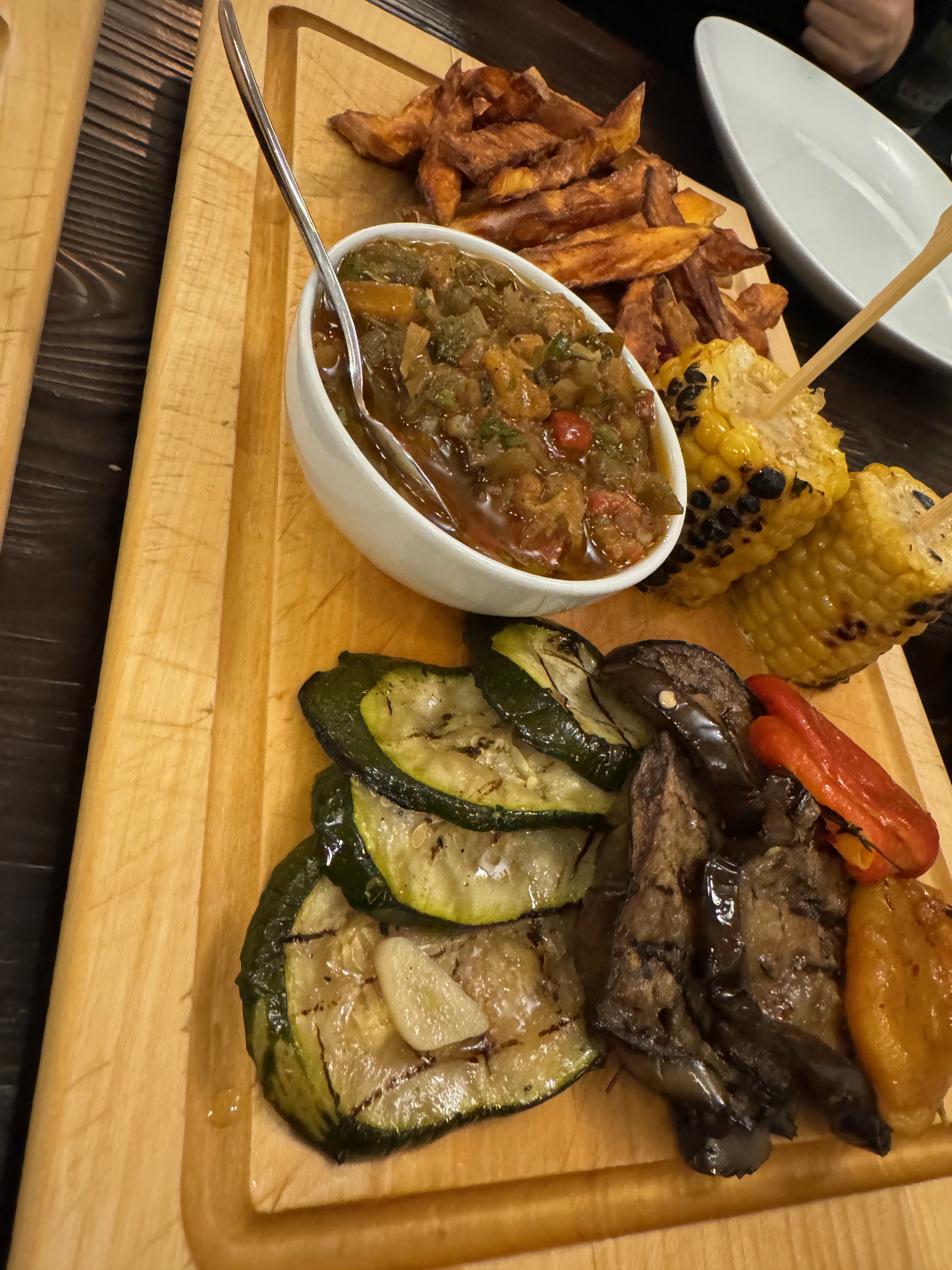 A BEEF BAR meal with grilled vegetables, potatoes, and corn